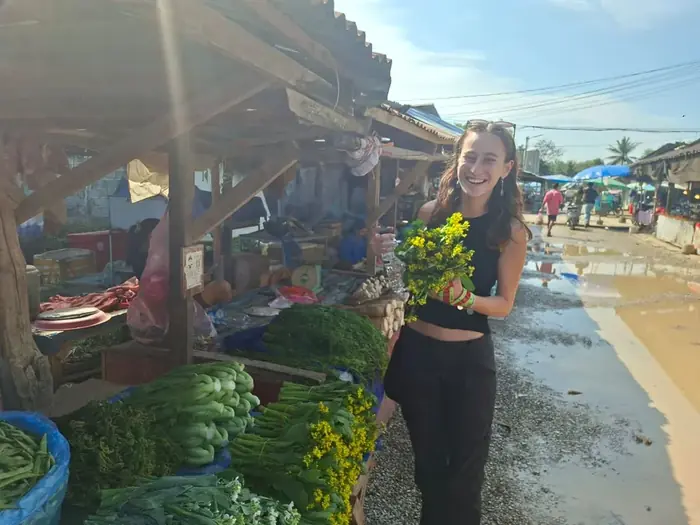 Tourist at local market near Khmu village, Vang Vieng