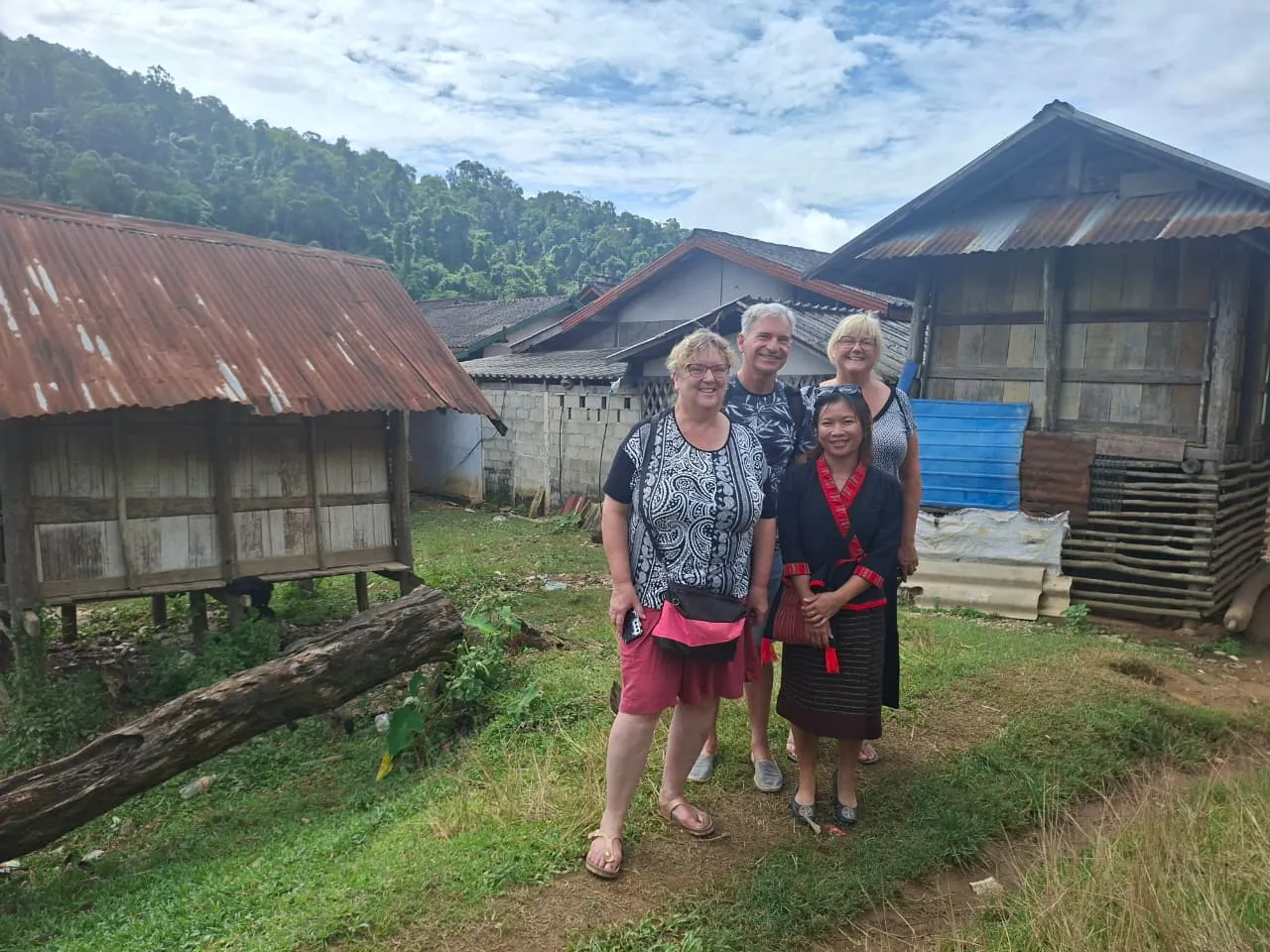 Travelers with a Khmu guide in the village