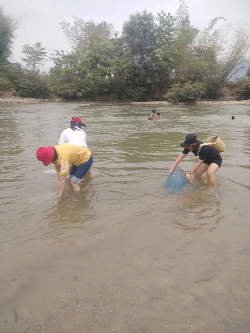 Traditional fishing with nets and baskets in the river